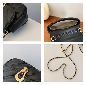 Detail view of black quilted crossbody bag with gold hardware and interior lining