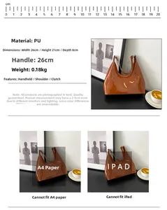 Detailed view of glossy brown patent leather bag with dimensions 26x21x8cm and weight info