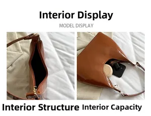Internal view of brown patent leather baguette bag showing storage space and zipper