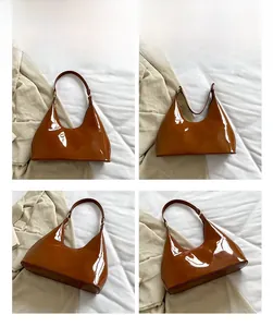 Multi-angle views of glossy brown patent leather shoulder bag with gold hardware