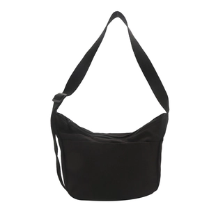 Minimalist black half-moon crossbody bag with adjustable wide shoulder strap for women