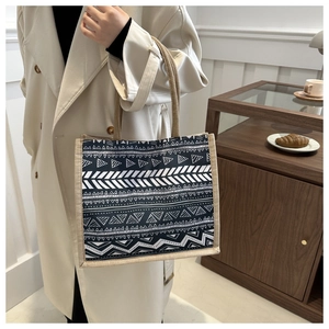 Linen tote bag with black and white geometric patterns and natural hemp rope handles