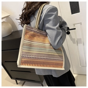 Detailed view of large Bohemian tote bag with geometric patterns and rope handles
