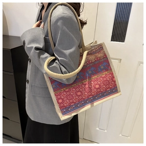 Detail view of ethnic elephant print tote bag with woven jute edges and rope handles