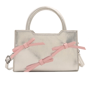 Silver metallic PU leather handbag with pink bows and adjustable shoulder strap