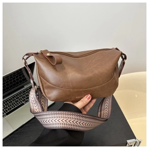 Brown vintage half-moon crossbody bag with geometric woven strap and fashion embossing