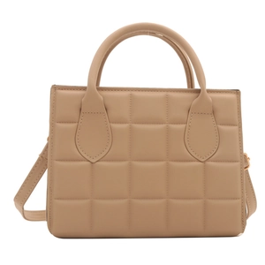 Beige quilted leather tote bag with elegant handles and adjustable shoulder strap