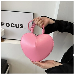 Sac à main rose en forme de cœur avec poignée supérieure et bandoulière ajustable