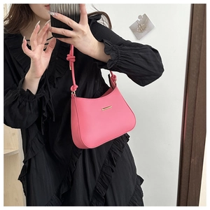 Pink crescent underarm bag in smooth PU leather with elegant knot strap and gold detail
