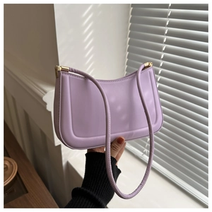 Detailed view of lilac semi-circle hobo bag with gold hardware and stitching