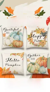 Detail view of four linen Thanksgiving pillow covers with pumpkin and autumn leaf prints