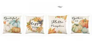 Close-up of four Thanksgiving pumpkin and maple leaf patterns on linen throw pillow covers
