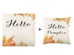 Macro detail of pumpkin and maple leaf print on thick linen Thanksgiving pillowcase