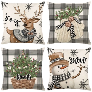 Set of 4 Christmas pillow covers with reindeer, snowman, and tree on plaid background