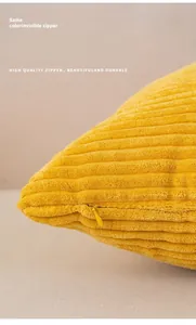 Close-up of matching invisible zipper on yellow corduroy decorative pillow cover