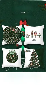 Detail of four Christmas pillow covers with Nutcracker prints in green and ivory