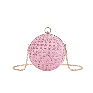 Pink spherical evening clutch with sparkling rhinestones and gold chain strap