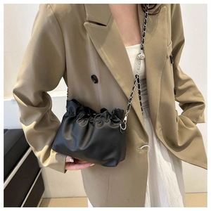Fashionable black pleated cloud bucket bag with silver chain strap and metal ball charm