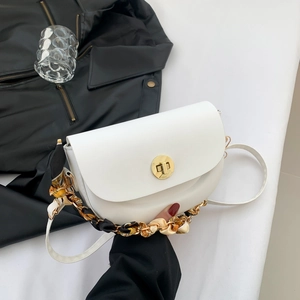 White semi-circular saddle bag with gold lock and silk scarf wrapped chain handle