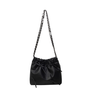 Fashionable black pleated bucket bag with bow accents and silver-tone chain strap