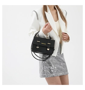 Detail of black crossbody bag with gold hardware and FASHION & BAGS logo text