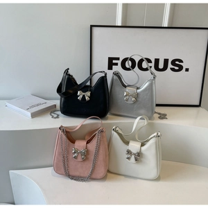 Detailed display of four bow hobo bags in black silver pink and white with metal chain straps