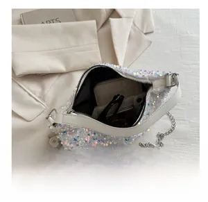 Detail showing high-capacity interior of sequin shoulder bag with accessories