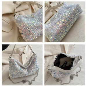 Detail view of sparkly sequin crossbody bag with chain strap and spacious interior