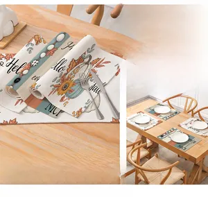 Detail of waterproof autumn placemats featuring pumpkin and sunflower leaf prints
