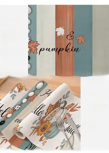 Detailed macro of the autumn pumpkin maple leaf print and neat stitched hem of the placemat