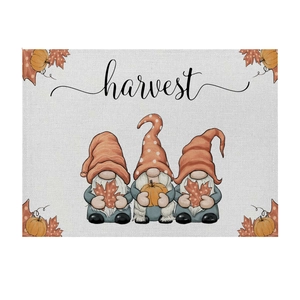 Fall harvest table mat featuring three cute gnomes with pumpkins and maple leaf designs