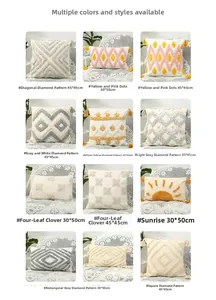 Detail view of tufted decorative pillow covers with geometric patterns and tassels