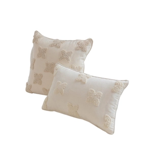 Nordic tufted flower cushions in cream white featuring textured fabric and elegant piping