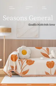 Close-up of beige chenille sofa cover with orange tulips and decorative fringe detail