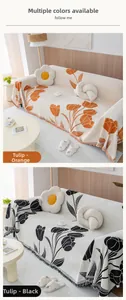 Close-up of chenille tulip pattern sofa cover with elegant fringe details in orange and black
