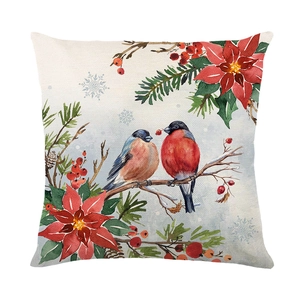 Square Christmas pillow cover with watercolor red birds and poinsettia on white background