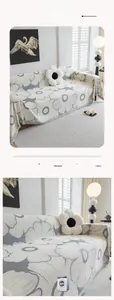 Detail of chenille sofa cover showing gray floral pattern and decorative fringe texture
