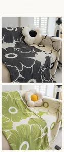 Detail view of daisy chenille sofa cover with floral texture and elegant fringe edges