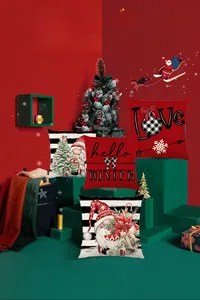 Detail view of four Christmas linen pillow covers with Santa and winter letter patterns