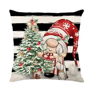 Christmas gnome hugging decorated tree on black white striped polyester pillowcase