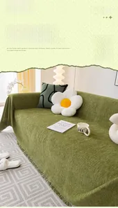 Close-up of matcha green chenille sofa cover with fringed edges and soft woven texture