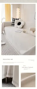 Detail of cream chenille sofa cover showing thick woven texture and handmade tassels