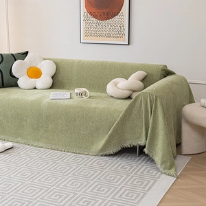 Sage green chenille sofa cover with fringed edges and textured fabric for home decor