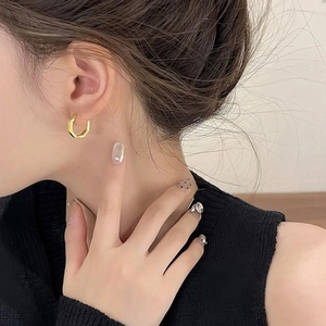 Textured hexagonal gold hoop earrings with faceted design for women in daily casual style