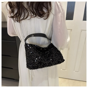 Women's black sequin underarm bag with leather strap and metal chain for evening wear
