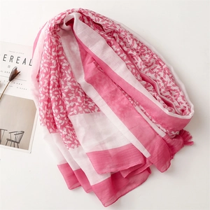 Chic pink leaf print linen-feel scarf with elegant fringes and minimalist design