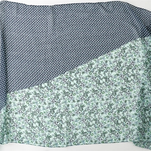 Linen feel scarf for women with green floral patterns and contrasting blue geometric prints