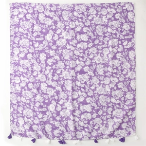 Detail of purple cotton linen scarf with white floral print and woven tassel trim