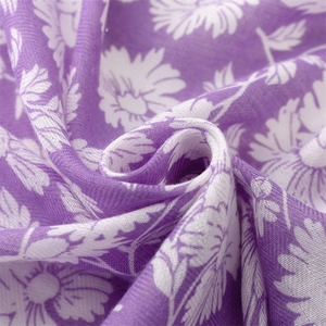 Close-up of soft purple cotton linen scarf featuring a delicate white daisy flower print