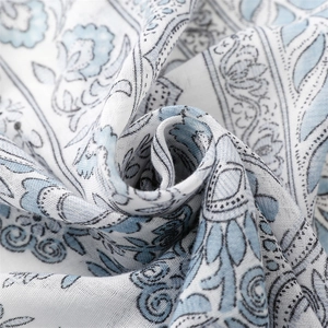 Detailed macro view of bohemian paisley linen-feel fabric in blue and white colors